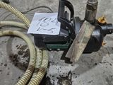 a hose that is connected to a machine on the ground