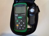a green and black electronic device in a black case