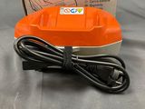 a close up of a box with a cord and a charger