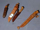 several different types of knives are lined up on a table