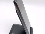 a close up of a cell phone on a stand