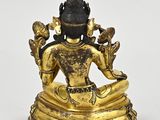 an image of a statue of a person sitting in a lotus position