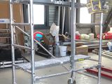 a picture of a metal work cart in a warehouse
