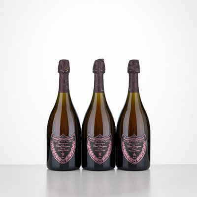 three bottles of wine sitting on top of a table