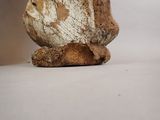a stone sculpture of a face on a rock