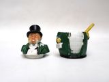 two figurines of a man in a top hat and green coat