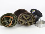 three helmets and a hat sitting next to each other