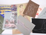 many different types of art work displayed on a table
