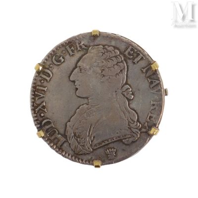 une vieille pièce d'argent sur laquelle figure la tête d'une femme coiffée d'une couronne
