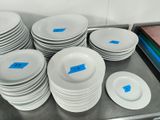 a lot of plates that are on a table