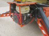 a small engine attached to the back of a tow truck