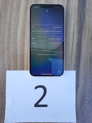 a close up of a cell phone sitting on top of a paper
