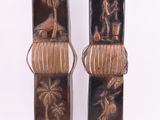 these are two decorative vases with a palm tree on them