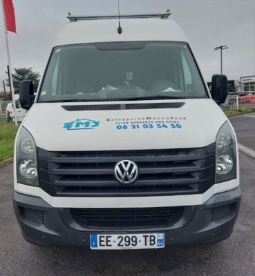 a white van that is parked on the side of the road