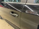 a car door handle with a sticker on it