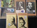 a lot of old postcards on the table