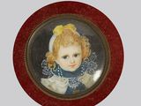 a picture of a little girl in a red frame