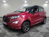 a red ford eco - pace suv parked in a showroom