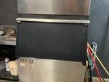 a silver and black ice machine in a kitchen