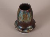a small vase that is sitting on a table