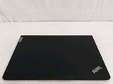 a black laptop sitting on a white surface