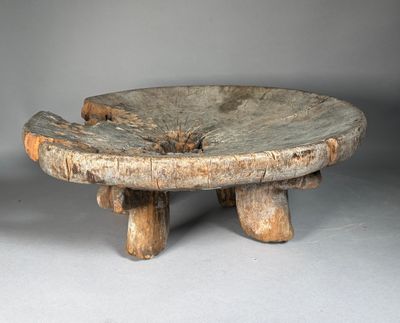 a small wooden table with two wooden legs on it