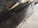 a close up of a car door handle with a sticker on it