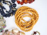 a lot of beads that are laying on a table
