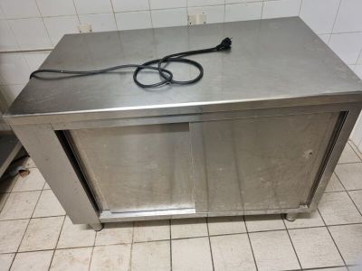 a metal counter with a pair of scissors on it