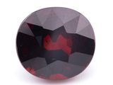 un gros plan d'un losange rouge et noir sur une surface blanche