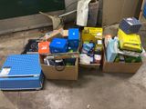a pile of boxes and other items on the floor