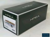 a box with a boat inside of it on a white surface