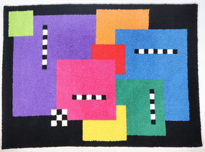 a colorful rug with squares and stripes on a black background