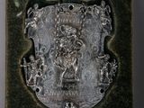 une image représentant une plaque métallique sur laquelle figure un blason