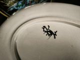 a white plate with a black design on it