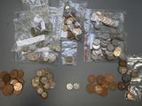 a lot of coins that are sitting on a table