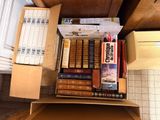 a box full of books sitting on top of a counter