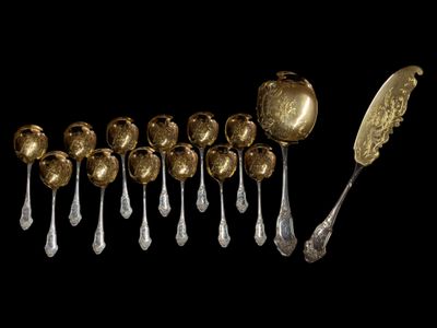 many spoons and spoons that are on a black surface