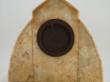 a small clock that is sitting on a table