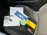 a picture of a car seat with a bunch of items on it