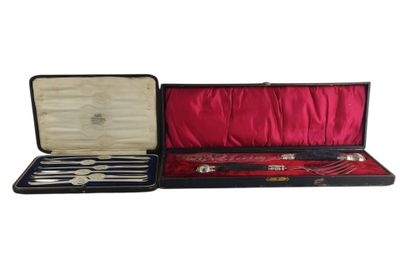 a black case with silverware in it on a white background
