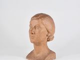statue of a woman ' s head on a white surface with a white background