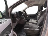 a view of the inside of a truck from the driver ' s seat