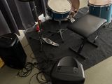 a drum set up on the floor in a room