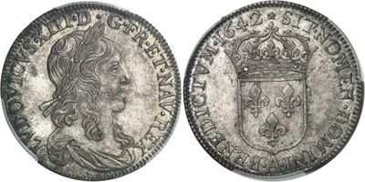 une pièce d'argent surmontée d'une couronne