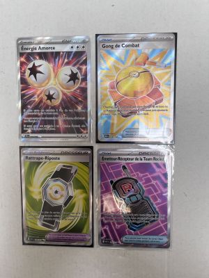 four different pokemon cards are on a white surface