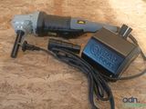 a corded drill and a power cord on a table
