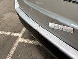 a close up of a car with a sticker on it ' s bumper