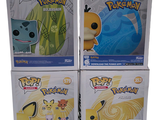 three boxes of pokemon pop vinyl figures on display in a store