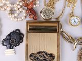 many different types of jewelry on a white surface